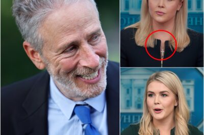 “DOES THE CROSS MEAN ANYTHING TO YOU?” — Jon Stewart’s One-Line Rebuke Leaves Karoline Leavitt Speechless — And Sparks a National Reckoning About Faith, Power, and Political Theater